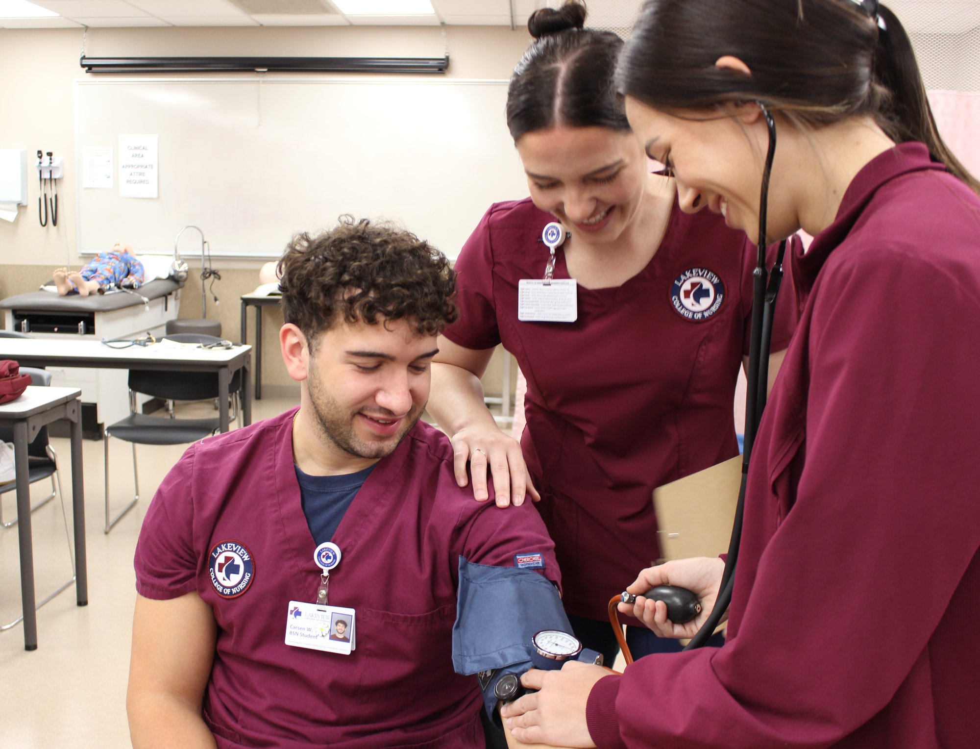 Students Taking Blood Pressure in Nursing Skills Lab